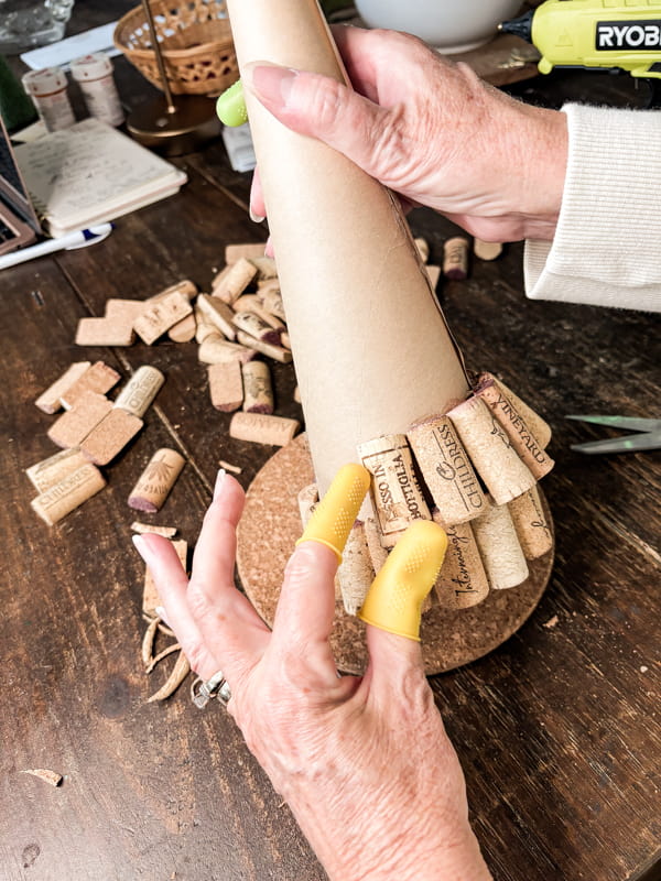 Add second row of wine corks to make a wine cork Christmas Tree with recycle wine corks.