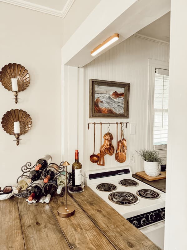 Tiny Beach Cottage Thrifted Finds, Brass shell scones and copper cooking utensils.  