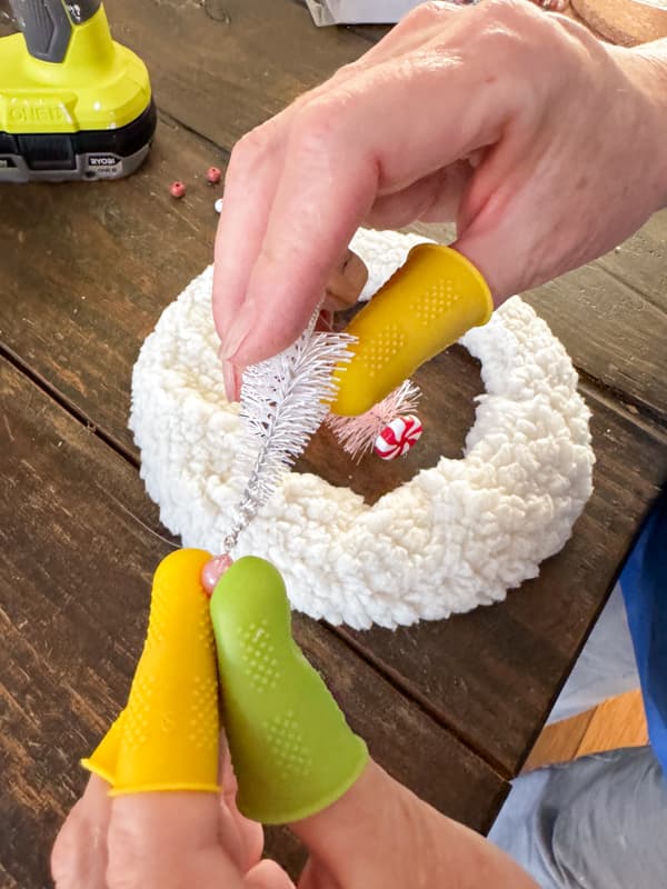 Add a bead to top of the tree with hot glue.