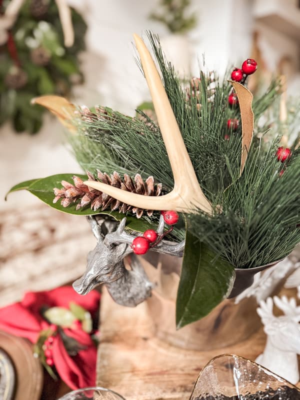 Deer Antler Centerpiece for a cozy rustic cabin Christmas dinner Party in the farmhouse.