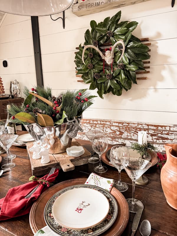 Deer Antler and Magnolia Wreath over the Antique Farmhouse Table Set for Christmas