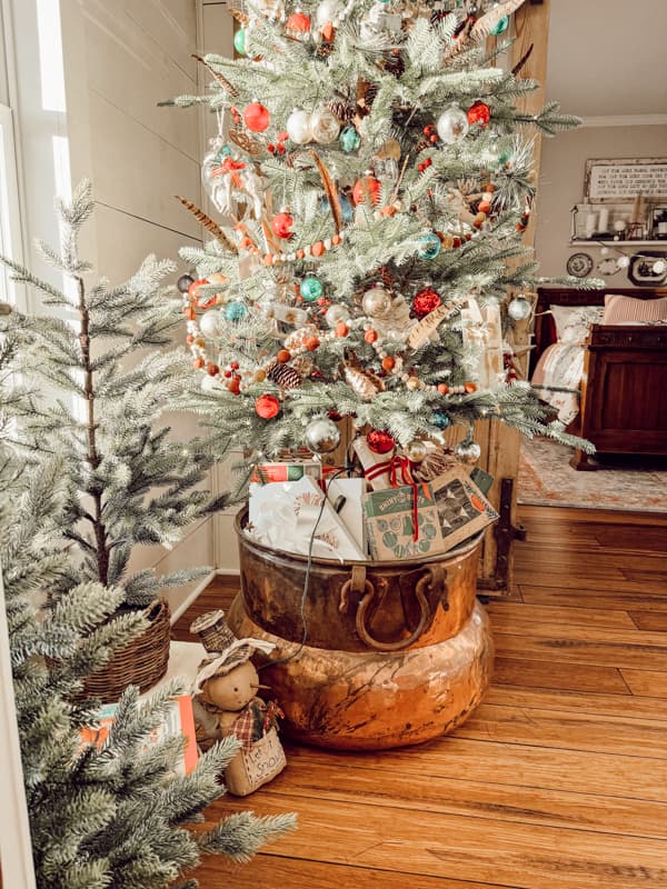 Large antique Copper Cauldron with Christmas Tree for a curated inspired decorating style.  