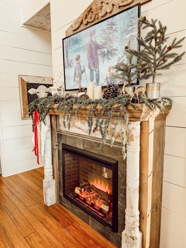 DIY Shabby Chic Faux Fireplace Decorated in vintage Christmas Style for a curated home and cottage core style.