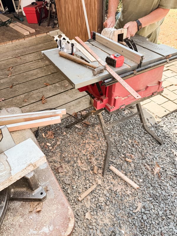 Use table saw to salvage all the architectural elements to construct the fireplace mantel for the farmhouse.