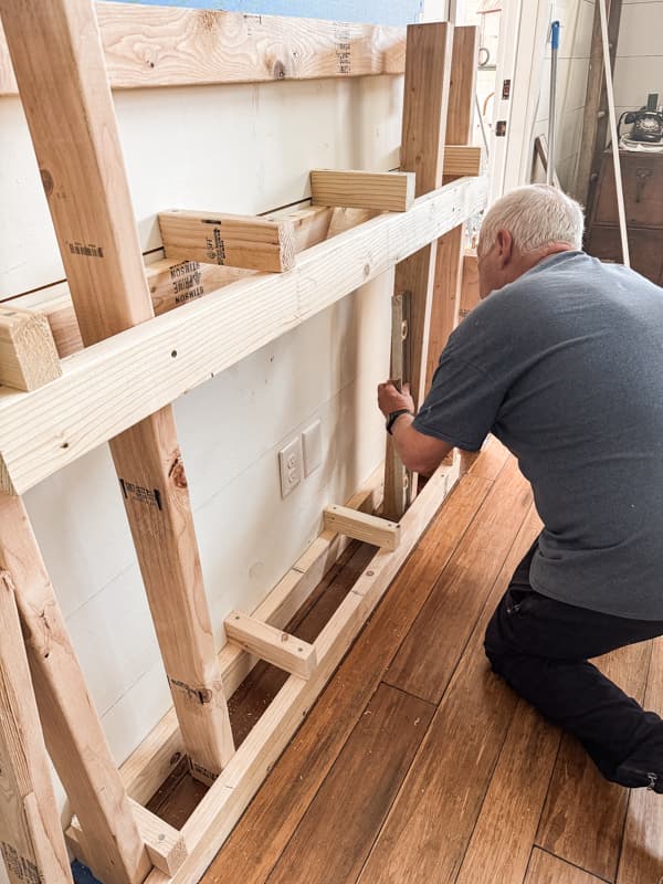 Level the frame work to build a shabby chic farmhouse style mantel.