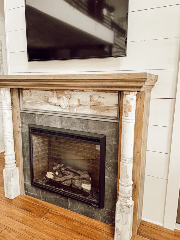 DIY Shabby Chic Fireplace Mantel from repurposed old porch posts.  