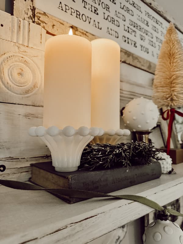 Candleholders with pillar flicker candles on shelf above bed. Christmas Farmhouse Decor Ideas