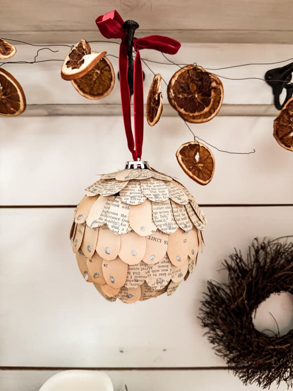 Upcycled Old book Big Christmas Ornaments look high-end when enchanced with glitter.