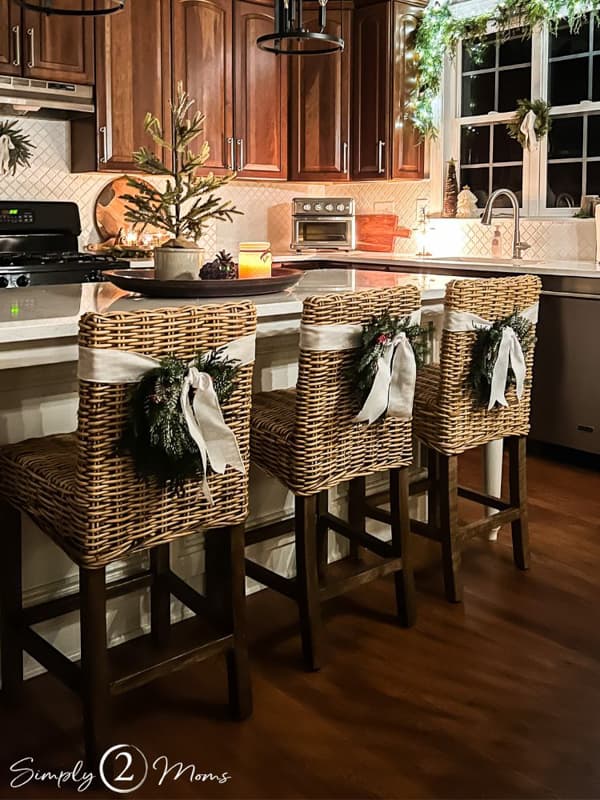 Add small greenery wreath to chair backs for a festive and unique Farmhouse Style Christmas.