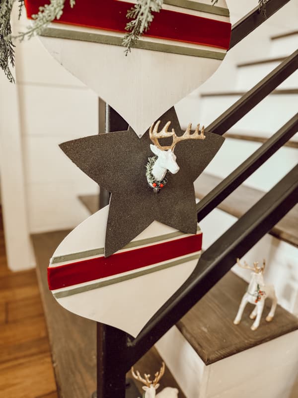 Large Christmas Ornaments made with Budget Dollar Tree Supplies.  Christmas Reindeer Ornament on a wooden star. Budget-friendly Holiday Decor.