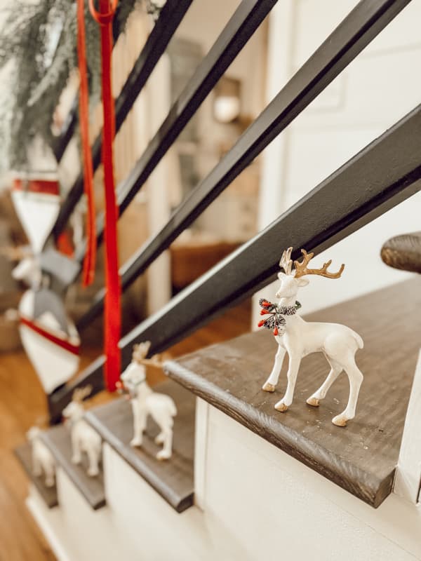 Add a rustic look to glam up Christmas reindeer from Dollar Tree with white paint and gold reindeer antlers.