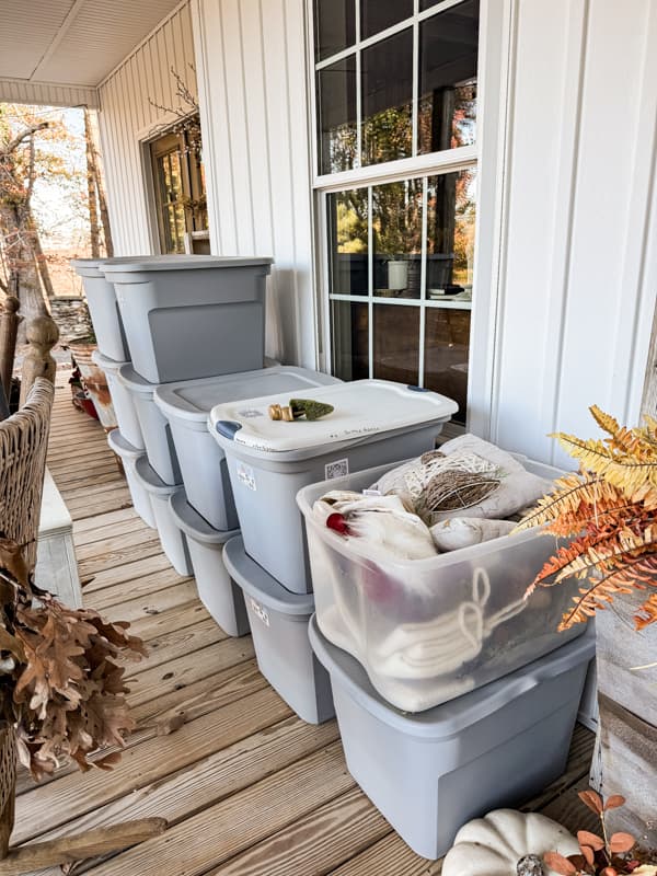 Christmas containers stacked on front porch