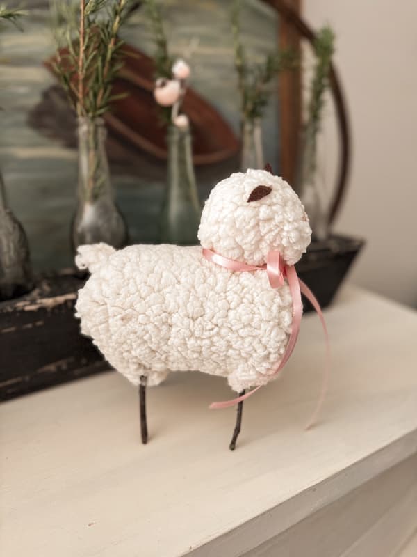 Christmas Lamb made from recycled tin cans. Easy recycled materials craft idea for the holiday.  