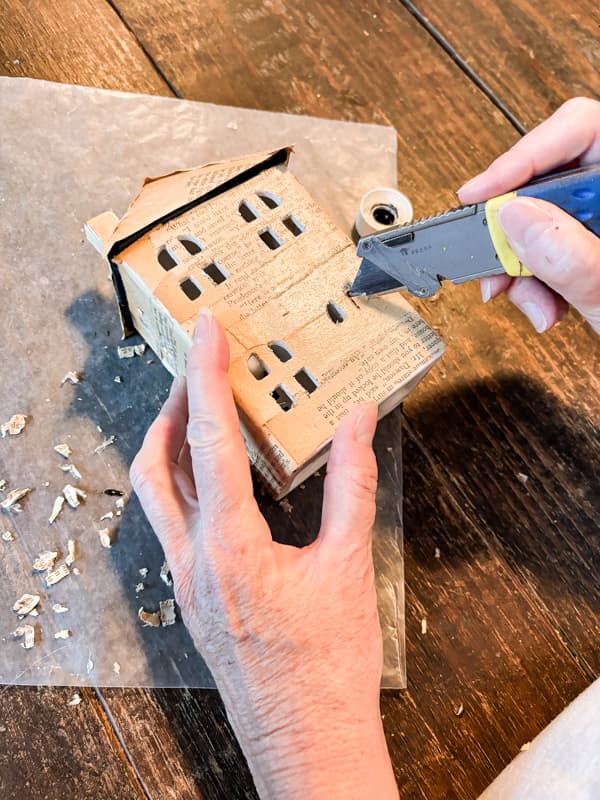 cut out windows and doors after the mod podge dries