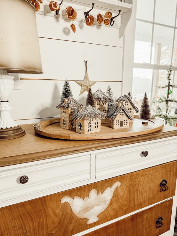 DIY Christmas Village Display Idea on a oval wooden tray.  Old Christmas Decor Transformation.