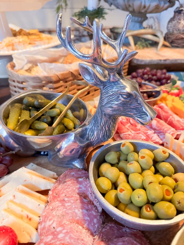 Olives and pickle in a pewter reindeer for a christmas party idea.  