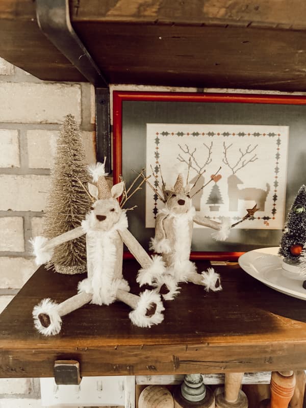 DIY Reindeer Christmas Decor from recycled toilet paper rolls and foraged gathered Twigs on shelf