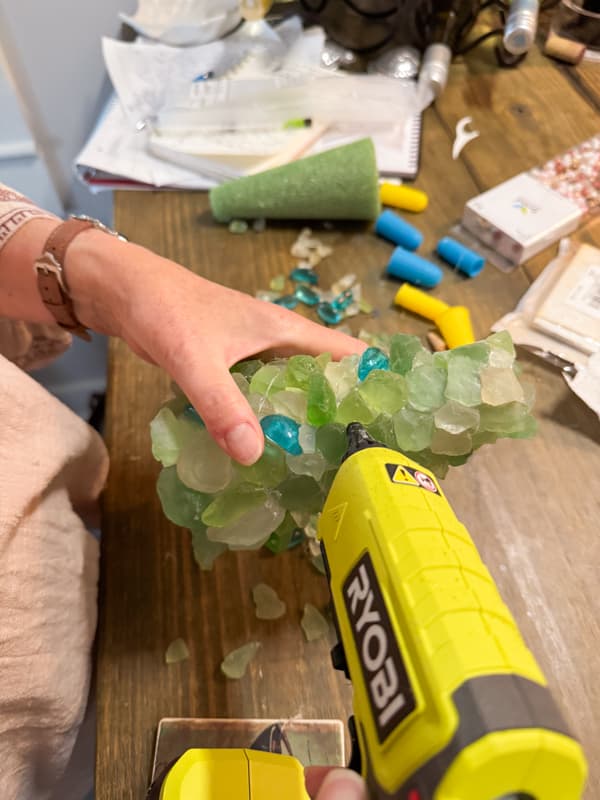 Add sea glass to cone with hot glue gun for DIY craft.  