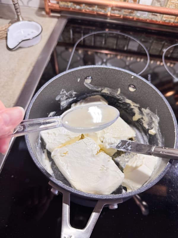 cream cheese in sauce pan with lemon juice 