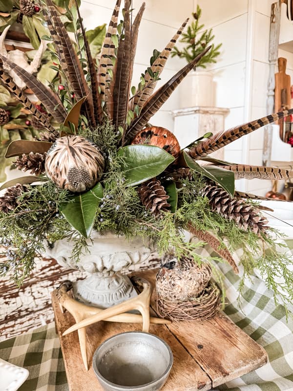 DIY Centerpiece with Fresh Evergreens and feather for Christmas Centerpiece Idea