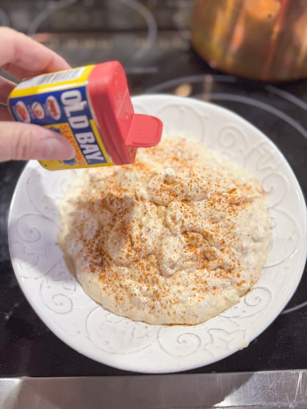 add old bay seasoning to the clam dip  party appetizer.