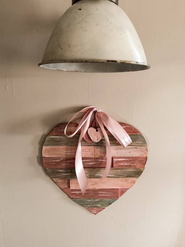Pink satin ribbon and clay heart charms on the pimitive Valentine's Decor heart