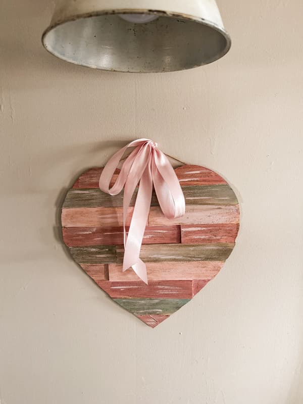 Hang the Rustic Valentine wood heart with a pink satin ribbon.