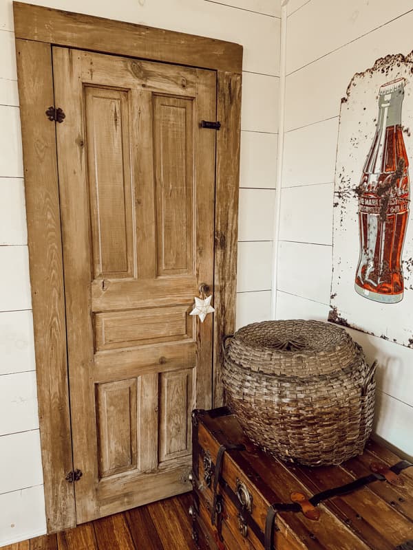 Small vintage door used for crawl space door in loft.  