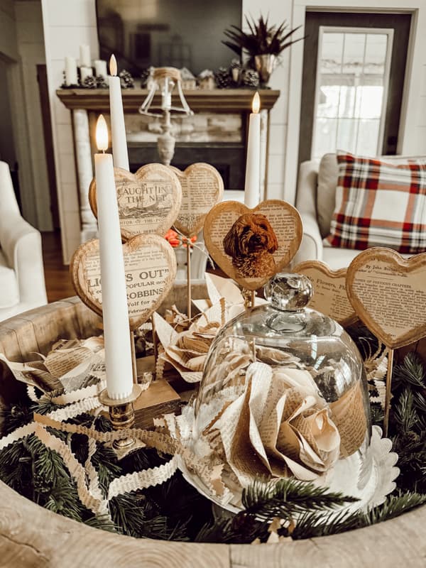 Old book page paper roses, glass cloche and flicker candles with Vintage Valentine Rustic Heart Decorations.