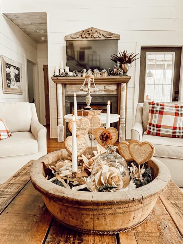 Rustic Valentine Decor fills old wooden bowl for coffee table centerpiece with personalized wood hearts.