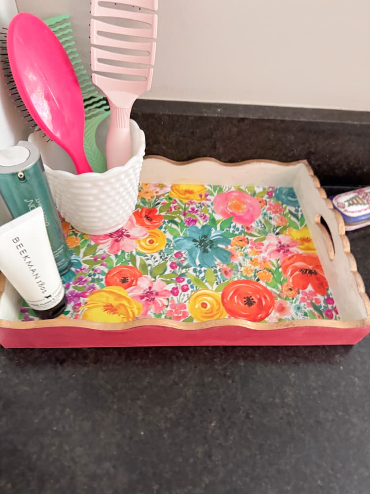 Dollar Tree Tray with floral scrapbook paper and gold trim repurposed for Bathroom tray