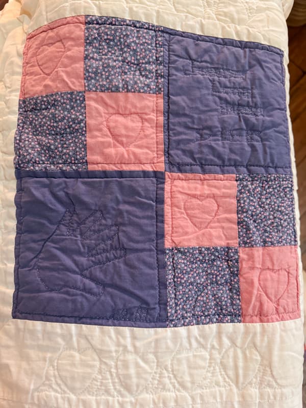 Vintage DIY quilt with tiny handprint quilted with name and date of birth.  