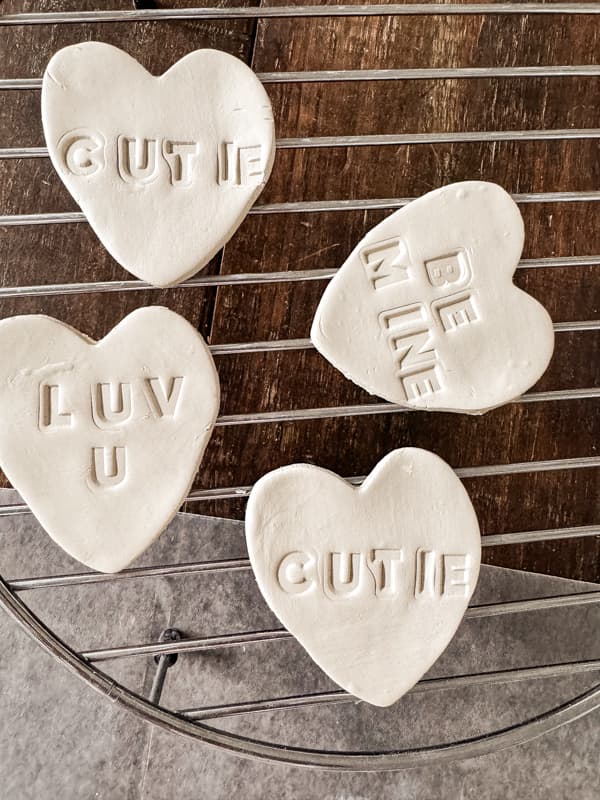 Dry clay hearts on a drying rack for handcrafted gift ideas.  