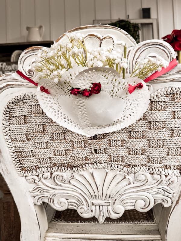 Valentiine's Day Chair Charms made with Dollar Tree paper heart doilies and filed with babies breath blooms.  