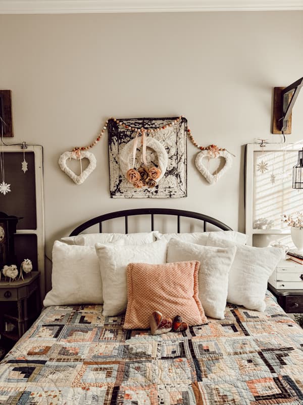 Cozy Winter Bedroom with Valentine Wreaths made with Dollar Tree frames and DIY paper roses.  