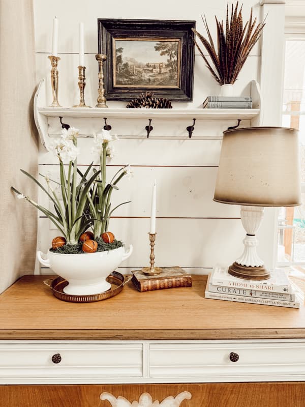 The entry table milk glass thrifted lamp for styling vintage ideas.  Paperwhites in a vintage soup tureen. 