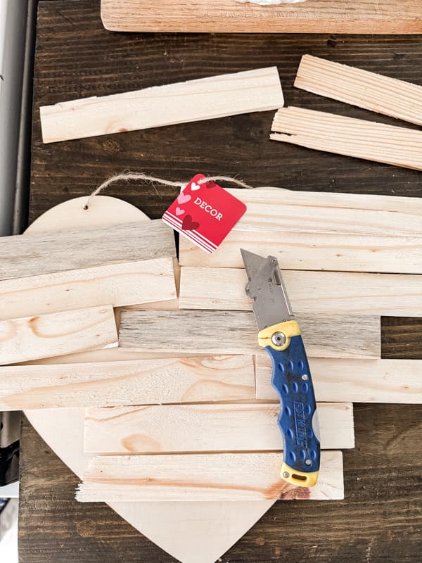 Easy Primitive Valentine's Heart made with Dollar Tree Valentine's DIY Craft and inexpensive wood shims.  