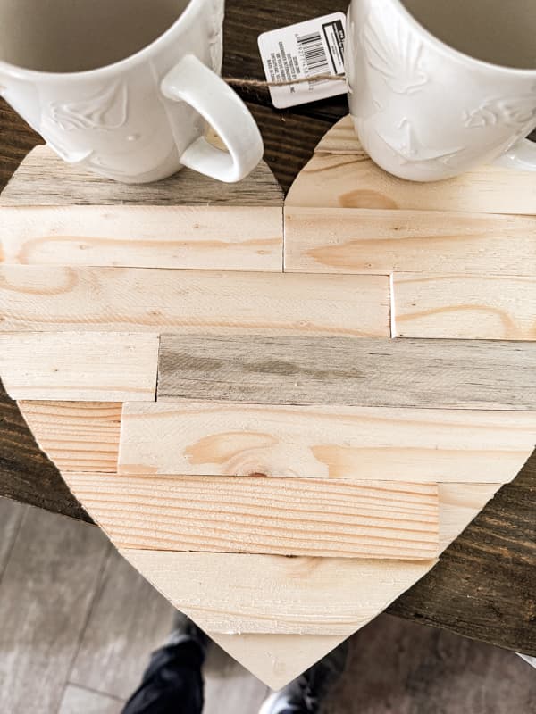 Attach wood shims with glue to cover the Dollar Tree Valentine's DIY