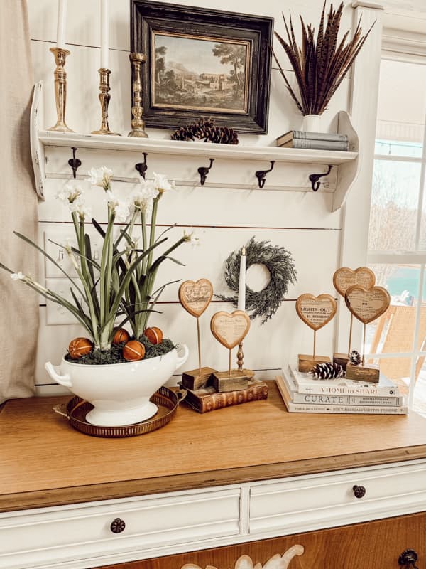 Set of 5 Vintage Valentine Wood Hearts on entry table with forced paperwhites and old books.  