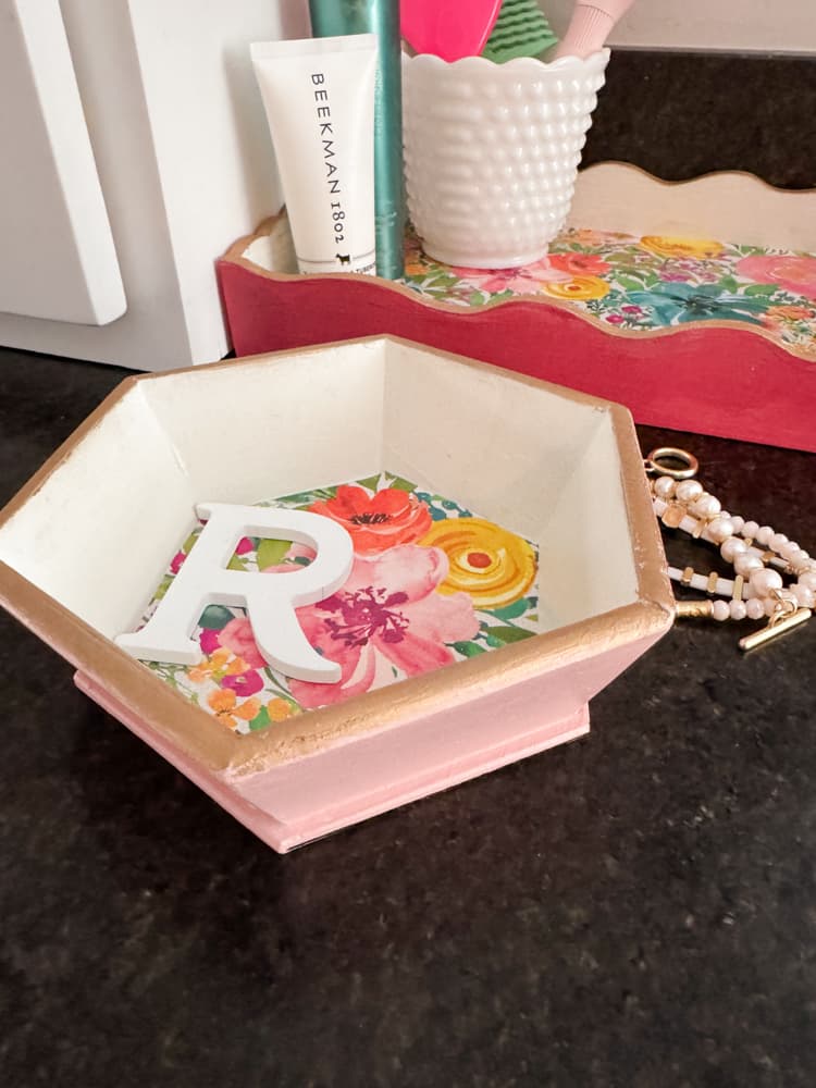 Hobby Lobby Wood bowl transformed into a Anthropologie Dupe Monogranned trinket tray with pink and white.