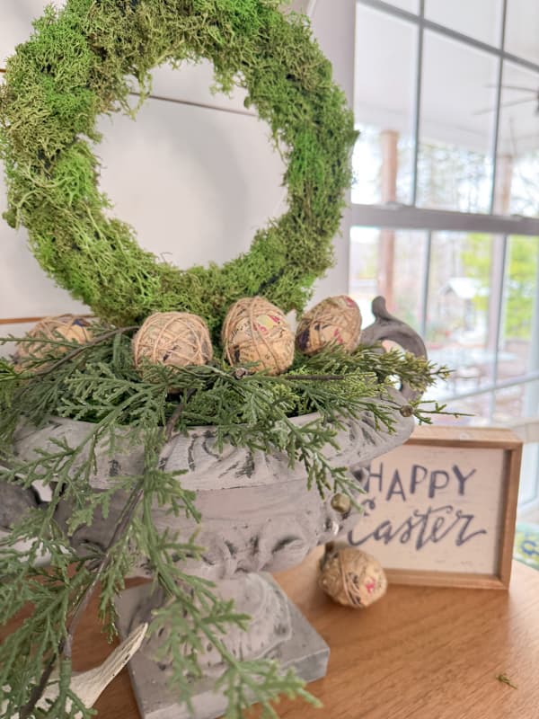 Fill container with greenery, moss and DIY Decoupage Easter Eggs Cover with Old Book Pages.