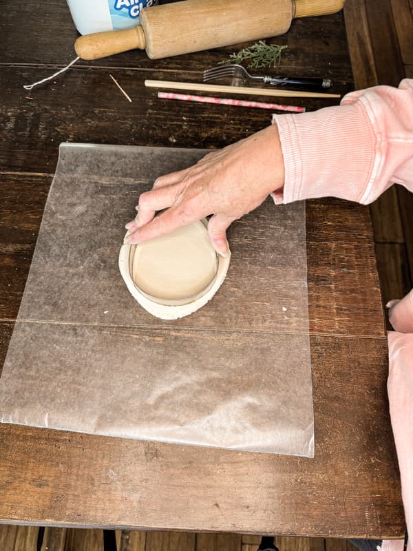 Cut clay with egg shaped cookie cutter