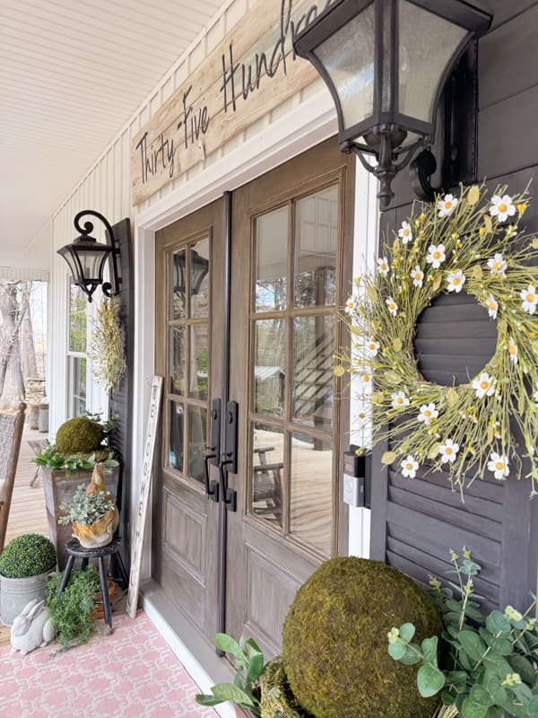 DIY Anthropologie Dupe Wreaths with metal flowers on DIY door shutters for DIY Porch Decor Farmhouse Style.  