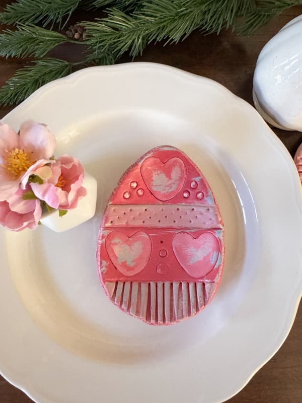 Easter Egg Plates made from air-dry clay decorate an Easter Table with Pottery Barn Easter Decorations Copy Cats. 