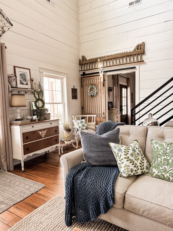 Antique Barn door with DIY Easter Egg Wreath in entry area for Spring Decorating Farmhouse Tour.