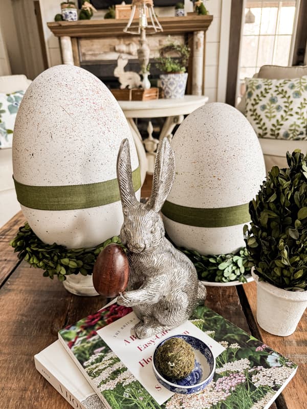 Use Dollar Tree Oversized Easter Eggs to create Farmhouse Speckled Eggs for Coffee Table Centerpiece with pewter bunny.