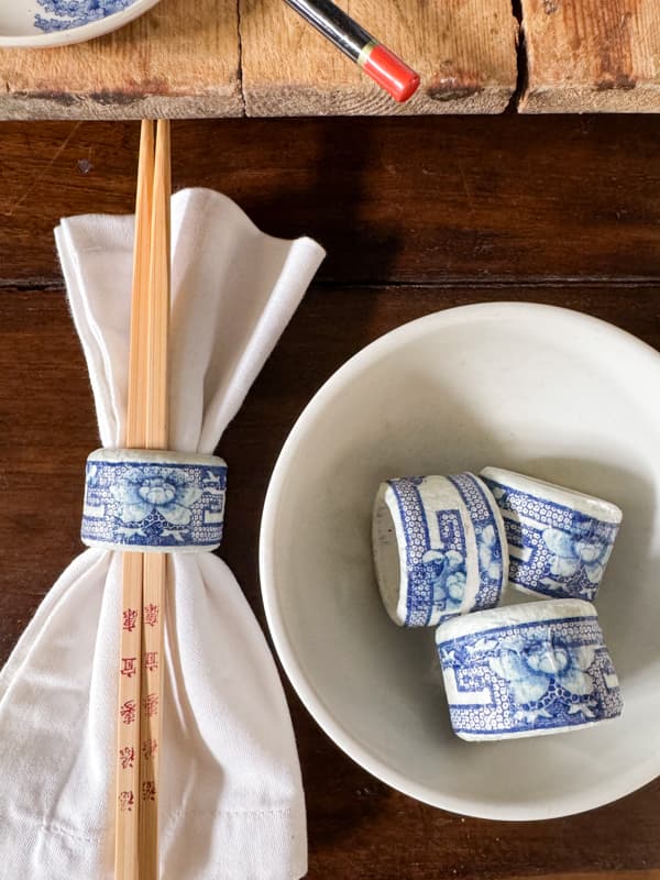 Budget-friendly DIY Thrift Store Napkin Rings Transformed into boutique worthy stylish blue and white napkin rings