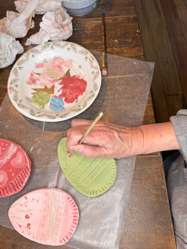 Paint the clay eggs with your choice of colors.