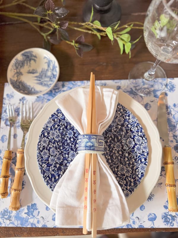 DIY Chinoiserie Blue and White Napkin Ring with white napkin and chop sticks for Chinese Dinner Party Place setting.  