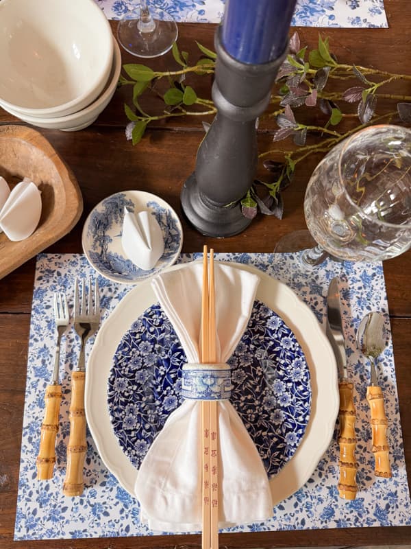 DIY Chinoiserie Blue and White Napkin Ring with white napkin and chop sticks for Chinese Dinner Party Place setting.